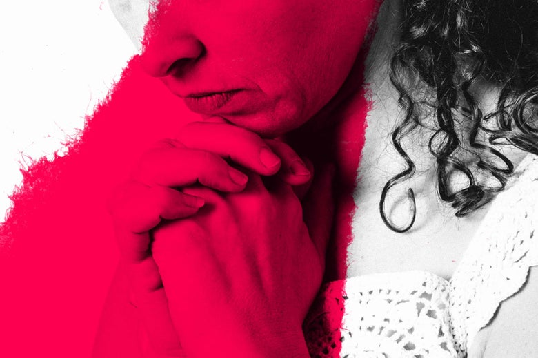Woman looking somewhat anxious while hands are clasped in prayer.
